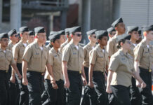 Group of youth cadets marching in uniform during a parade