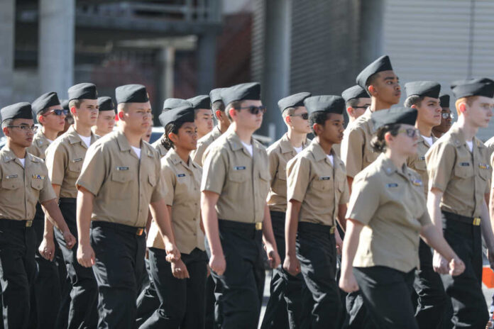 Group of youth cadets marching in uniform during a parade