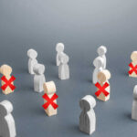 Wooden figures with red X marks, signifying eliminated individuals.