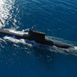 A submarine navigating through the ocean waters