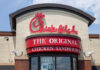Exterior view of a Chick-fil-A restaurant featuring a prominent sign