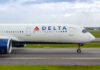 Side view of a Delta Airlines airplane on the runway