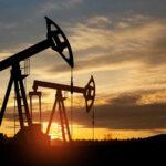 Country’s Walkout Stuns Global Oil Markets Oil pump jacks silhouetted against sunrise sky