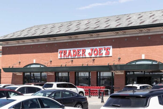 Exterior view of a Trader Joe's grocery store with parked cars