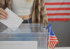 UNPRECEDENTED Move Threatens How America Votes Person casting vote into a ballot box.