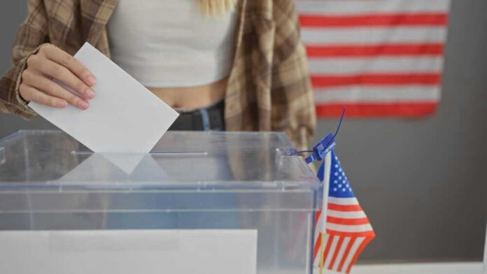 Person casting vote into a ballot box.