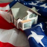 Trump BREAKS Mortgage Gatekeepers A model house placed on an American flag