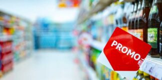 Promotional sign in a grocery store beverage aisle