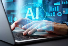 Person typing on laptop with AI hologram