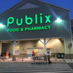 Exterior view of a Publix grocery store at dusk