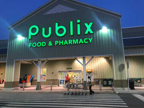Exterior view of a Publix grocery store at dusk