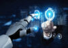 Human and robot interacting with virtual screen.