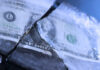 80% Training Freeze Shocks Army Readiness A dollar bill partially encased in ice