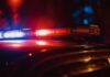 Stampede Erupts — 19 Harmed In Mass Casualty Event Close-up of a police car's emergency lights at night