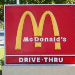 McDonald’s KILLING Beloved Freebie McDonald's drive-thru sign with iconic golden arches