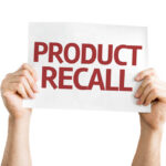 HAZARD: 800,000 Recalled Hands holding a sign that reads 'PRODUCT RECALL'