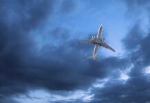 Spy Planes Swarm Cuba’s Coast An airplane flying through a cloudy sky