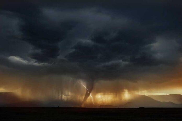 A dramatic storm with dark clouds and a lightning strike over mountains