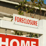 Foreclosure Surge Shocks Nation: Unseen In Years Foreclosure sign indicating a home for sale
