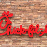 Chick-fil-A Locks Doors, Doubles Down on THIS! Chick-fil-A restaurant sign on a stone wall