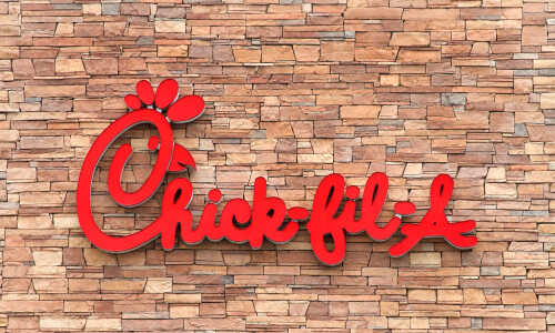 Tustin,,Ca,-,June,17,,2018:,Chick-fil-a,Is,An,American Chick-fil-A restaurant sign on a stone wall