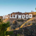 Beloved TV Dad Gone — Fans Saddened Hollywood Sign on a green hillside, sunny day.