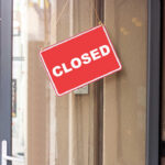 Small Towns Brace: 175 Stores Axed A red 'CLOSED' sign hanging on a storefront door
