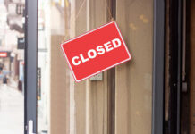 Small Towns Brace: 175 Stores Axed A red 'CLOSED' sign hanging on a storefront door