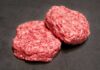 Beef Spike Blindsides Summer Cookouts Ground beef on display at a butcher shop.