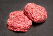 Beef Spike Blindsides Summer Cookouts Ground beef on display at a butcher shop.
