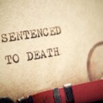 Supreme Court Bombshell Slams Death Penalty Case Close-up of a typewritten document stating 'SENTENCED TO DEATH'