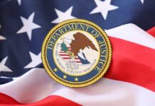 Weaponized DOJ? Dem Governor Lights The Fuse Department of Justice seal on an American flag background