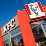 Massive KFC Menu Overhaul Underway Exterior view of a KFC restaurant with its iconic logo