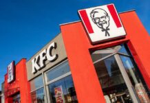Massive KFC Menu Overhaul Underway Exterior view of a KFC restaurant with its iconic logo