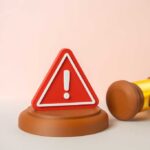 Track Meet Turns Deadly — Verdict Stuns Leftists A red warning sign next to a legal gavel on a light background