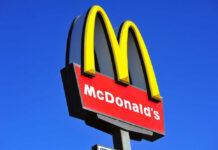 McDonalds logo on a pole clear sky