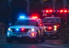 Chimney Horror At Public School Police car and ambulance with flashing lights nighttime