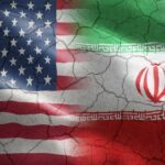 American Blood Spills — What Did Iran Hit? Flags of the United States and Iran blended together with a cracked texture