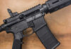 AR-15 Bans Head To The Supreme Court Black rifle on wooden surface close up