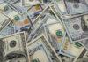 Billionaire Cash Bomb Hits 25 Million Kids Scattered hundred dollar bills with Benjamin Franklins portrait.