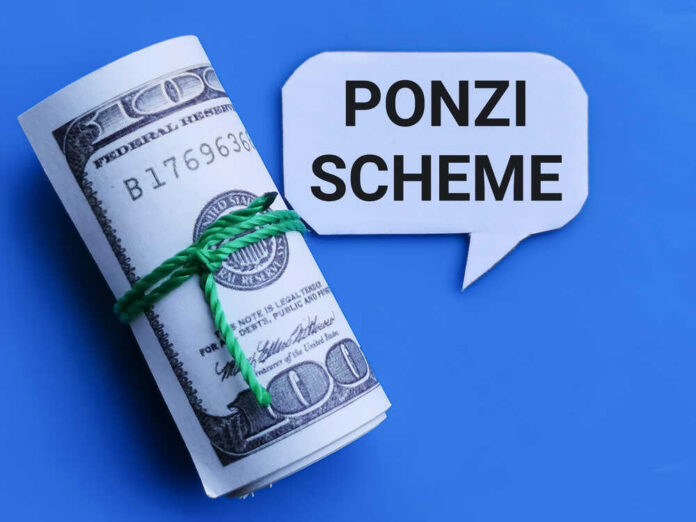 shutterstock_1946706163 Rolled hundred dollar bills with a speech bubble saying 'Ponzi Scheme'