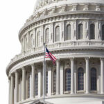 Dynasty Twist In D.C. U.S. Capitol dome with American flag flying.