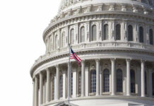 Dynasty Twist In D.C. U.S. Capitol dome with American flag flying.