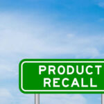 Exploding Grill Lids Spark Urgent Recall Green sign with product recall text and sky background