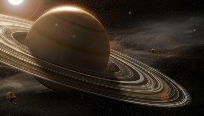 Incredible,Image,Of,Saturn,With,The,Rings,Illuminated,By,The A stunning view of Saturn with its rings and surrounding celestial bodies