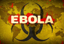 Ebola Alert — American Rushed To Europe Biohazard symbol over world map referencing Ebola