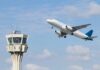 Airport Gate Arrests Spike — What Changed? An airplane taking off near an airport control tower
