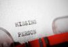 Close-up of a typewritten document with the words 'MISSING PERSON'