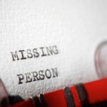 Close-up of a typewritten document with the words 'MISSING PERSON'