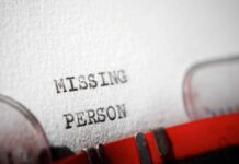 Close-up of a typewritten document with the words 'MISSING PERSON'
